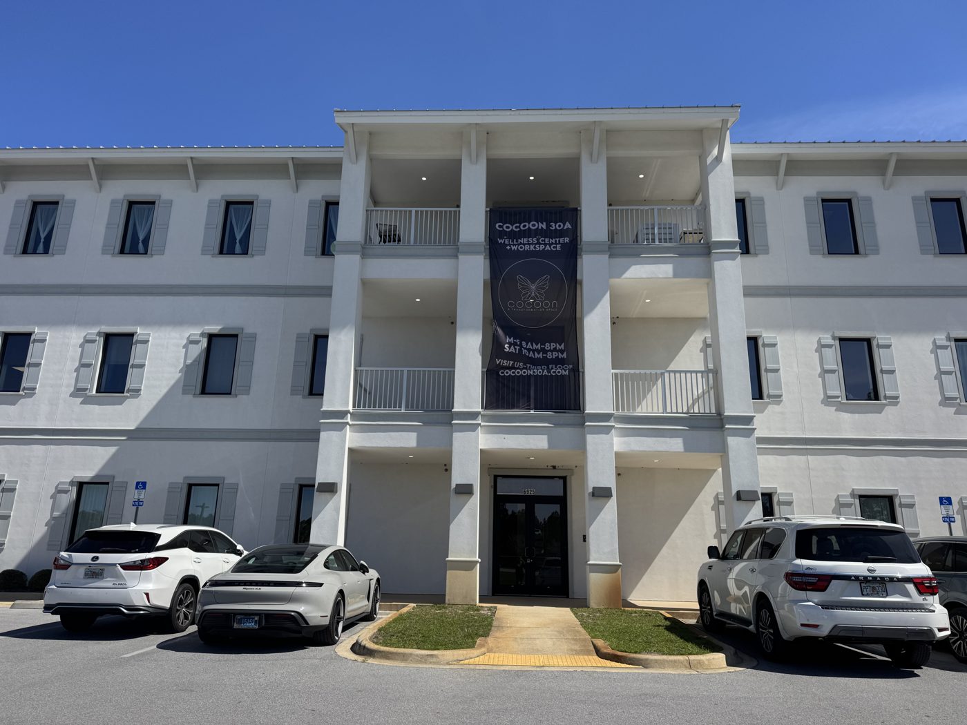 The Enclave at Dune Lakes building with Cocoon30A banner, Santa Rosa Beach FL